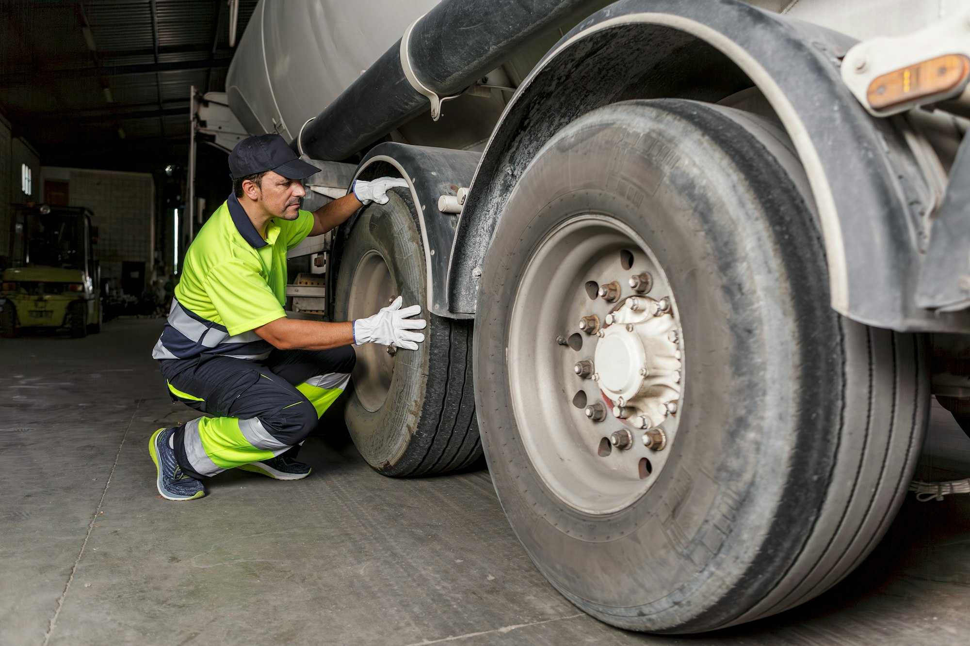 Mechanic checking the wheel of a truck