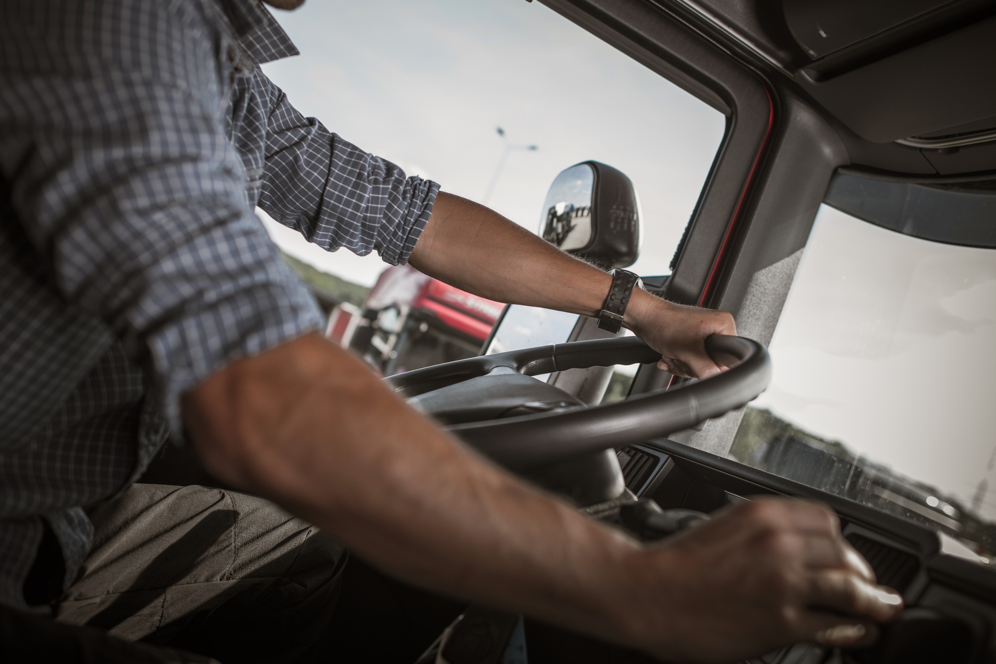 Trucker Behind the Wheel.